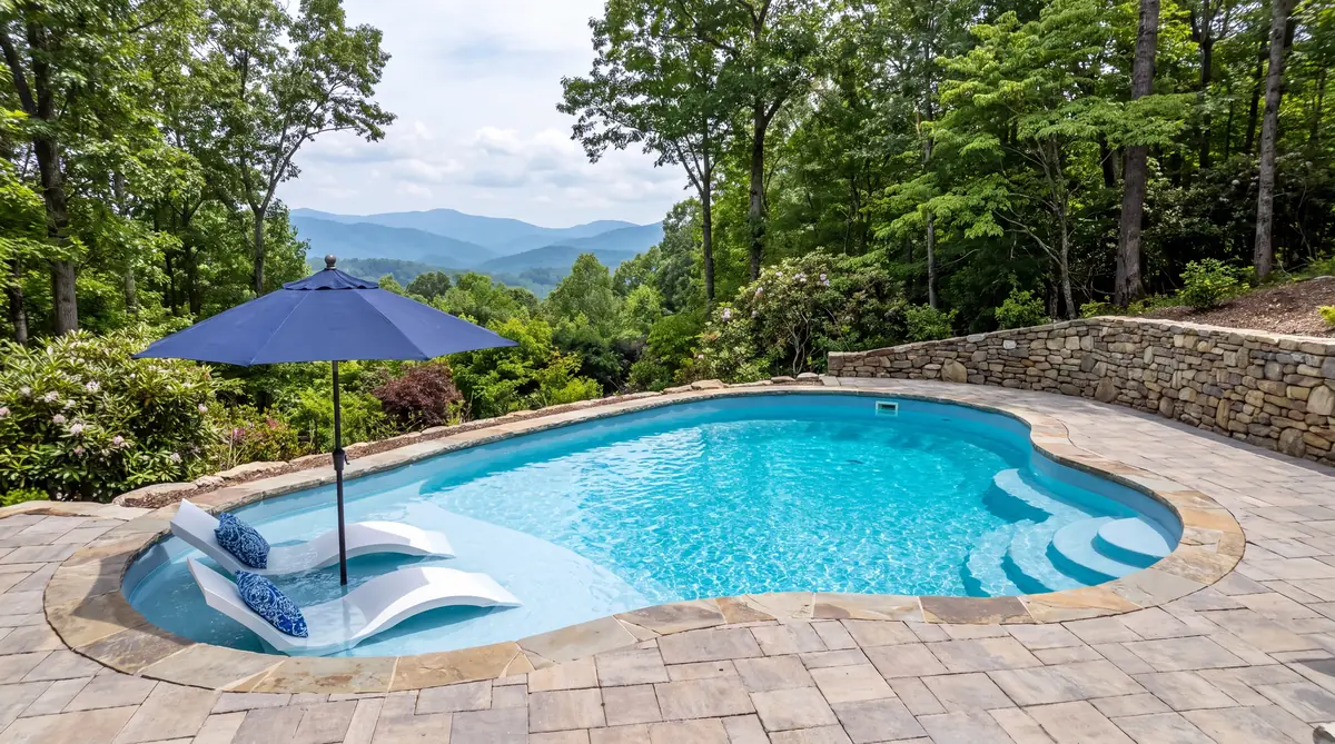 Fiberglass pool with a tanning ledge