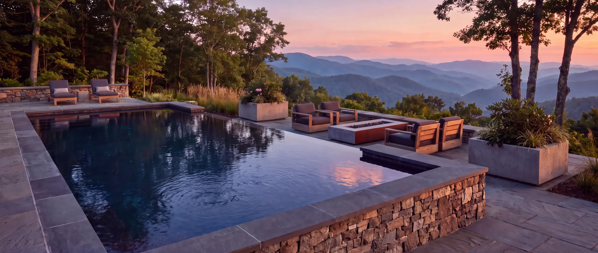 Infinity edge pool with a mountain view at sunset